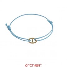 Bracelet cordon motif or forme ovale barré