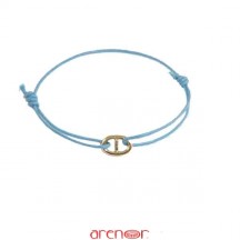 Bracelet cordon motif or jaune forme ovale barré